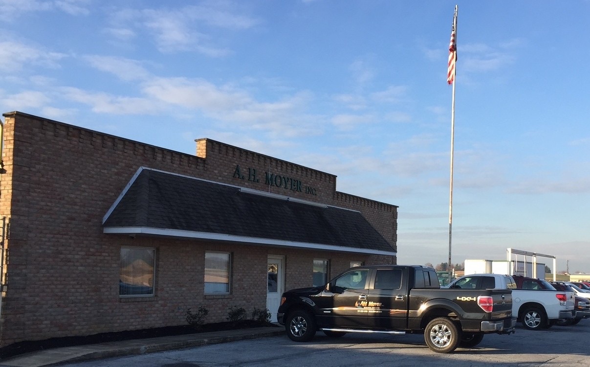 Brick commercial building with an A.H. Moyer sign