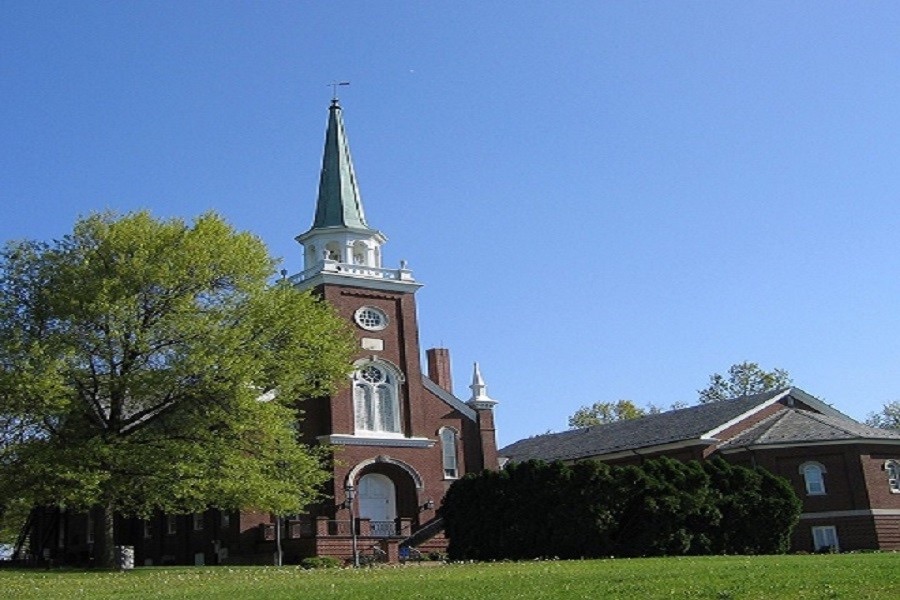 Brick church with a white steeple